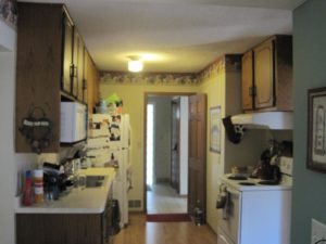 Dated and cramped kitchen before makeover