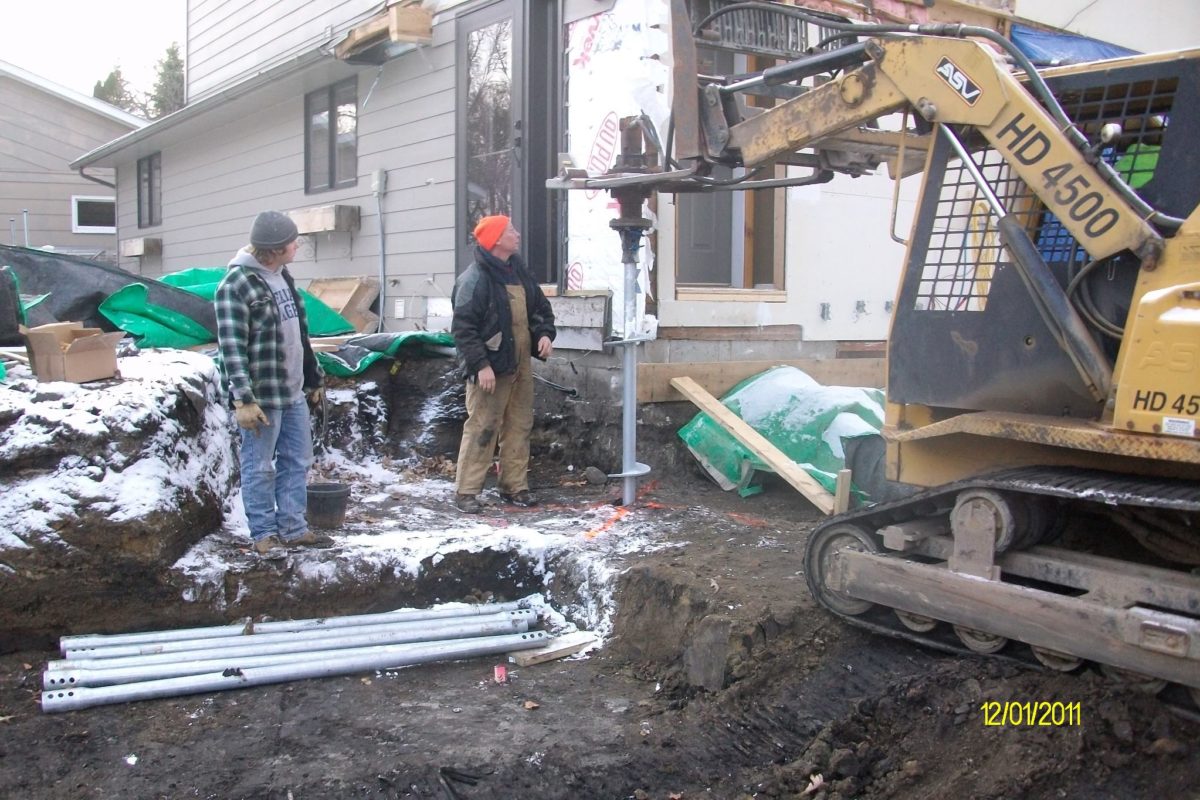 Product being lowered into the ground.