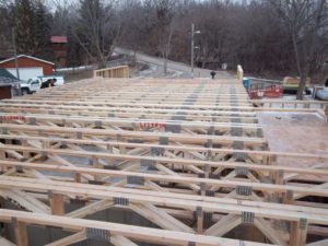 Floor trusses being installed