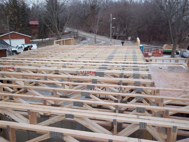 Floor trusses being installed