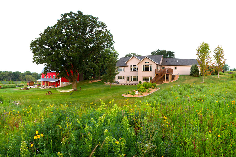 view of back of house and barn